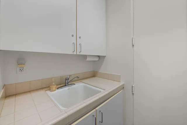 an aerial view of residential house and sandy dunes