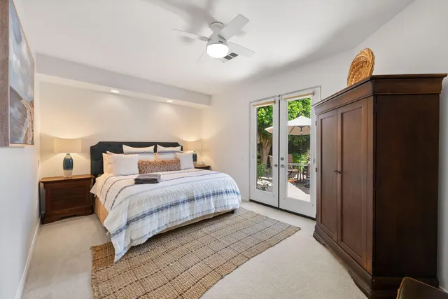an aerial view of a house with a yard and lake view