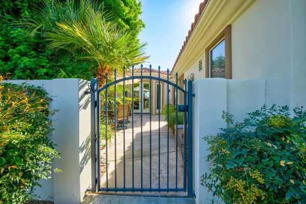a living room with furniture flat screen tv and windows