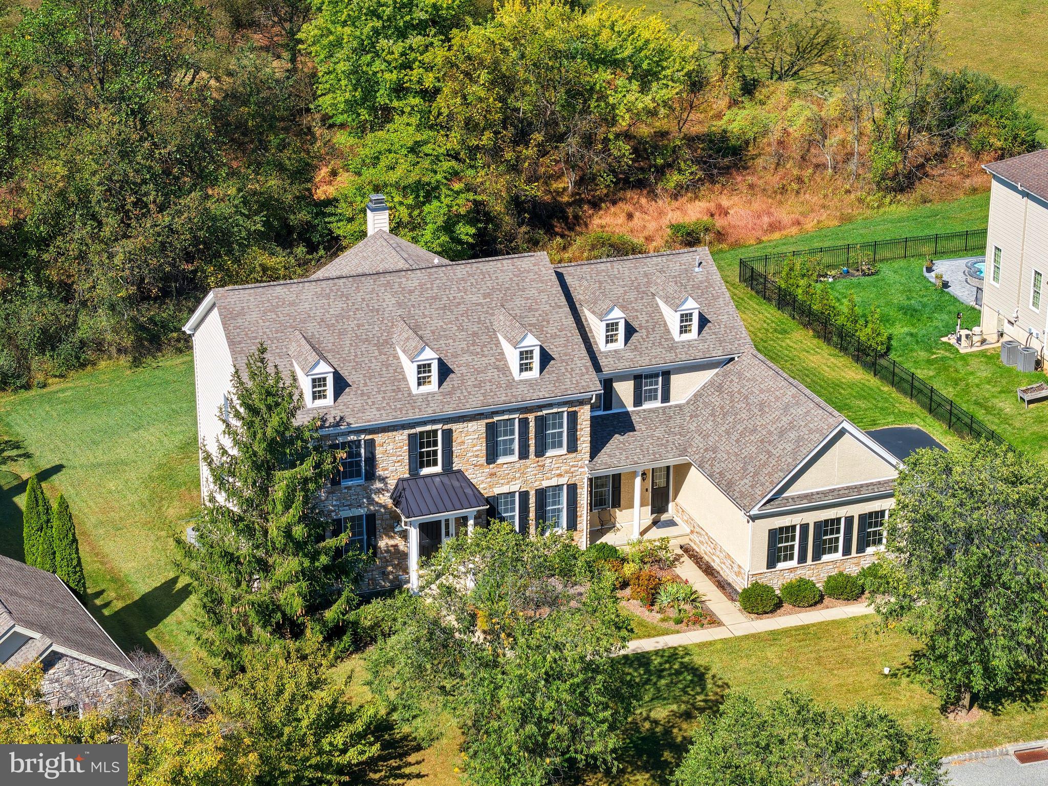 an aerial view of a house with a garden