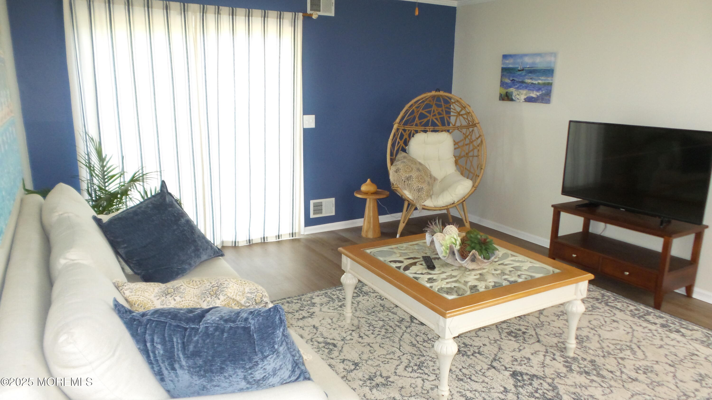 4 Olympus Way Brick, NJ 08724 - Photo 19 of 39 a living room with furniture and a flat screen tv