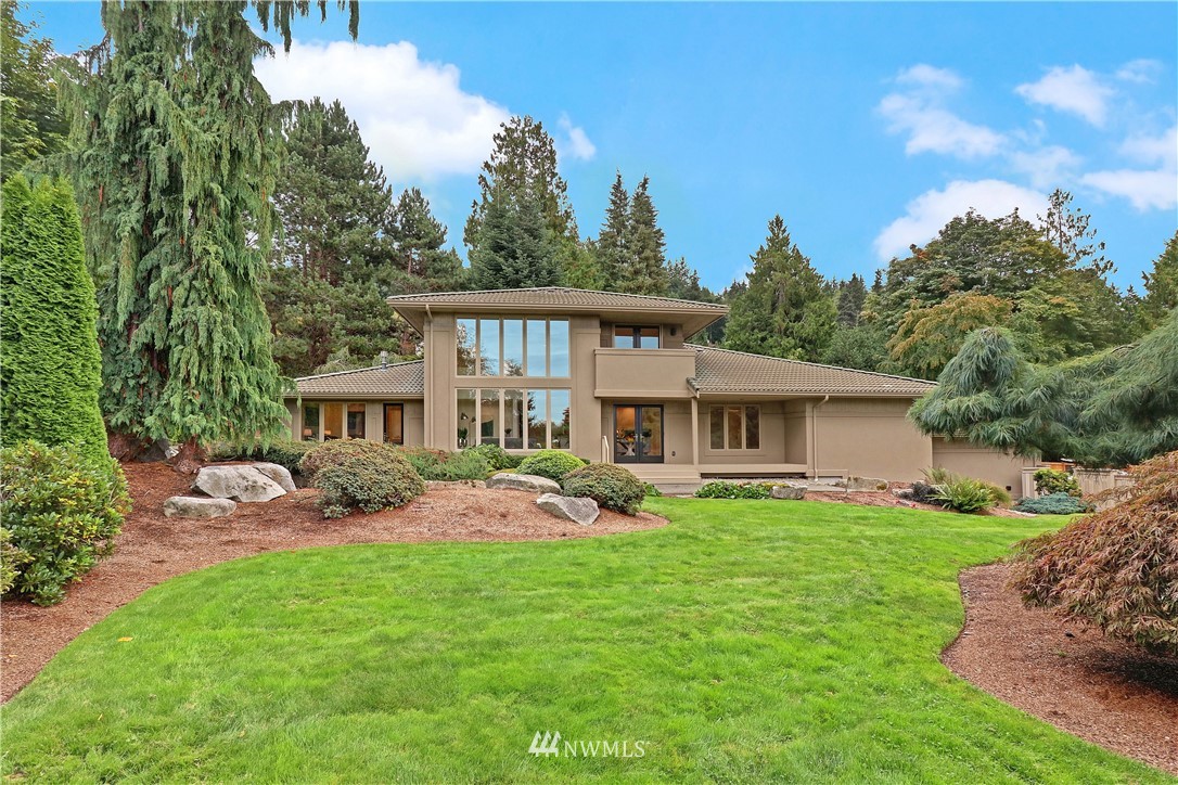 8233 Talbot Road Edmonds, WA 98026 - Photo 22 of 25 a view of a house with a yard and sitting area