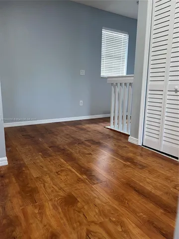 a bathroom with a toilet and a shower curtain