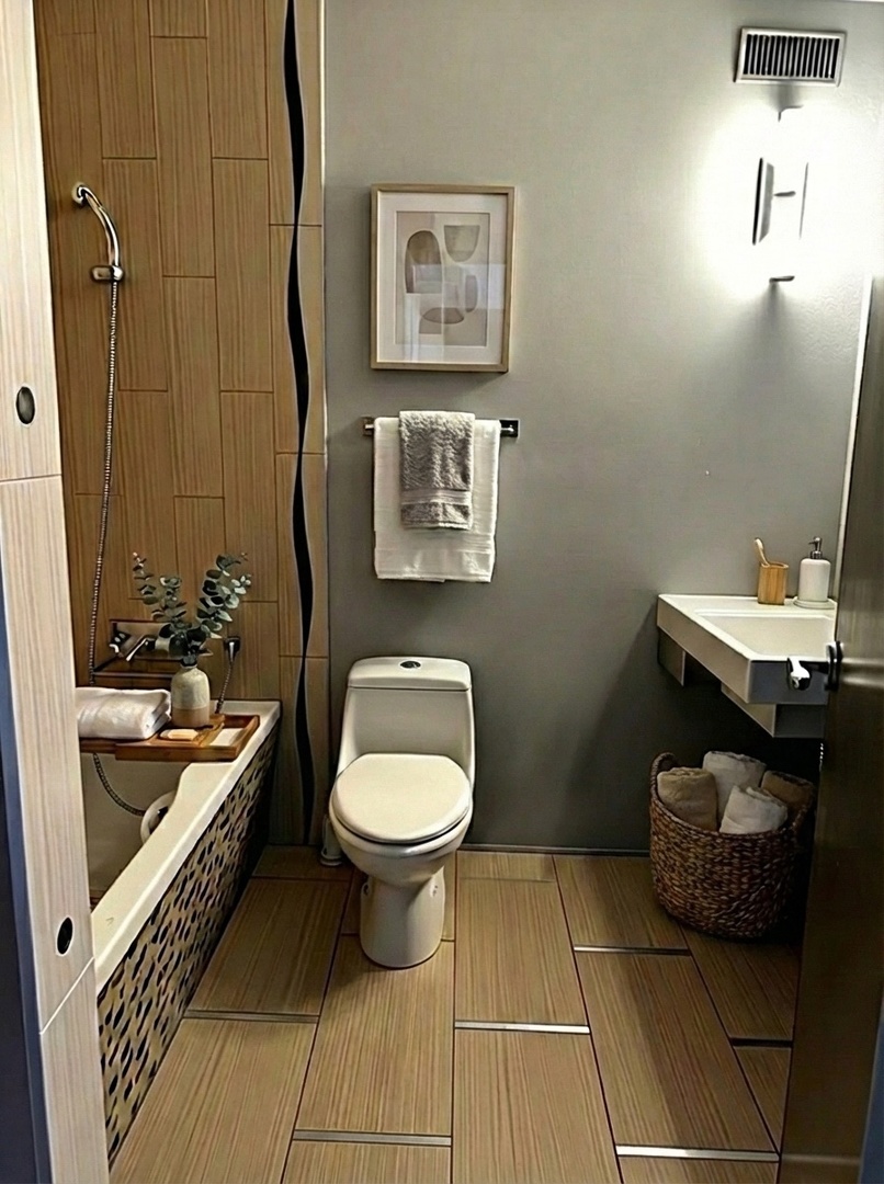 5415 North Sheridan Road, Unit 4506 Chicago, IL 60640 - Photo 8 of 13 a bathroom with a sink a toilet and bathtub