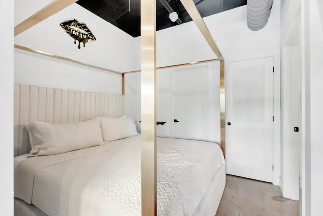 a bedroom with a bed and a cabinets