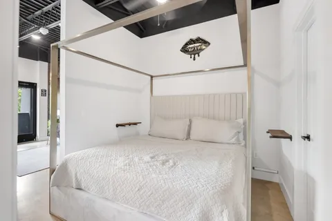 a large white bed in a white room