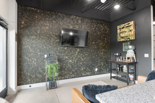 a living room with furniture and a flat screen tv