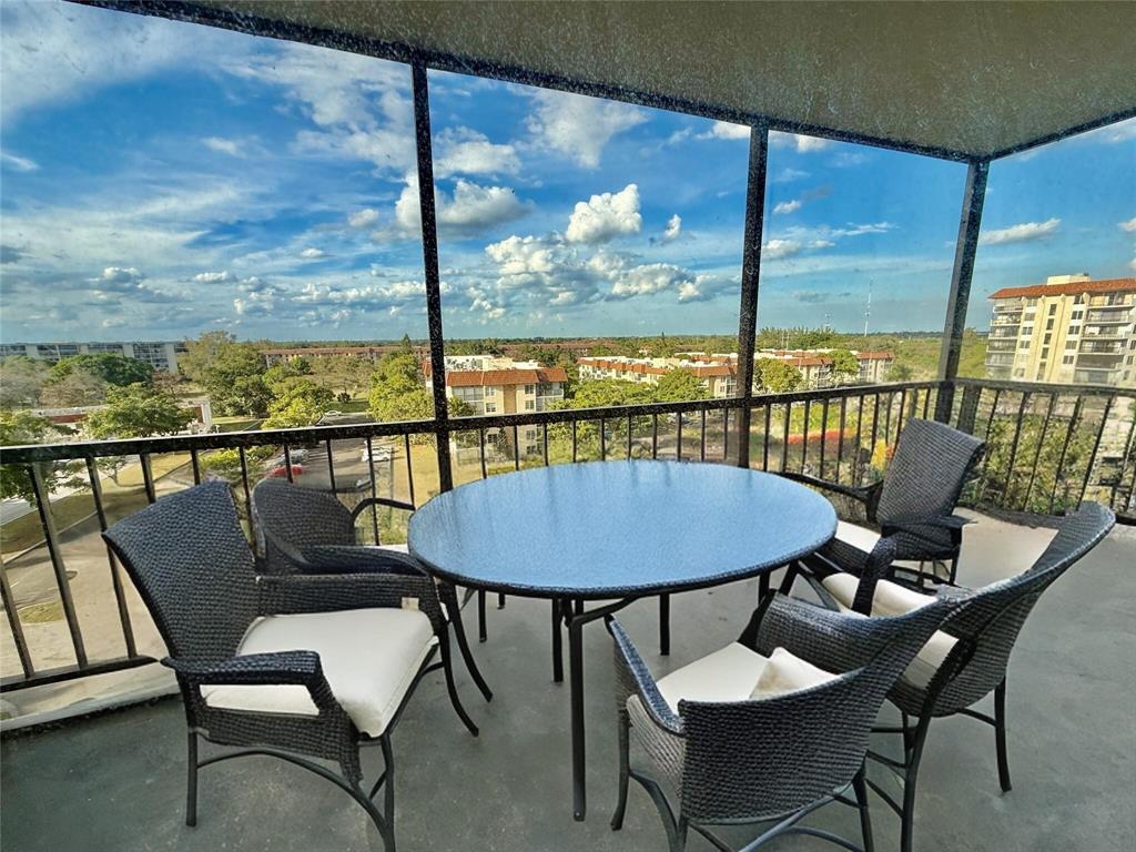 a view of a dining room with furniture window and outside view