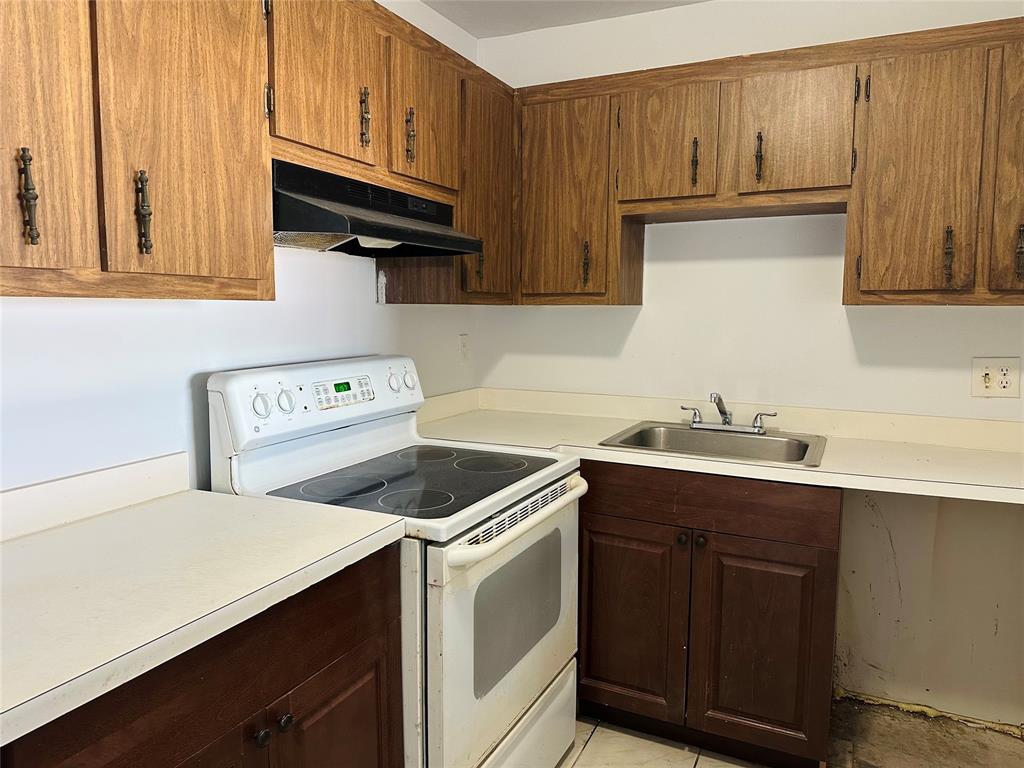 4174 Inverrary Drive, Unit 805 Lauderhill, FL 33319 - Photo 11 of 26 a kitchen with a sink cabinets and appliances