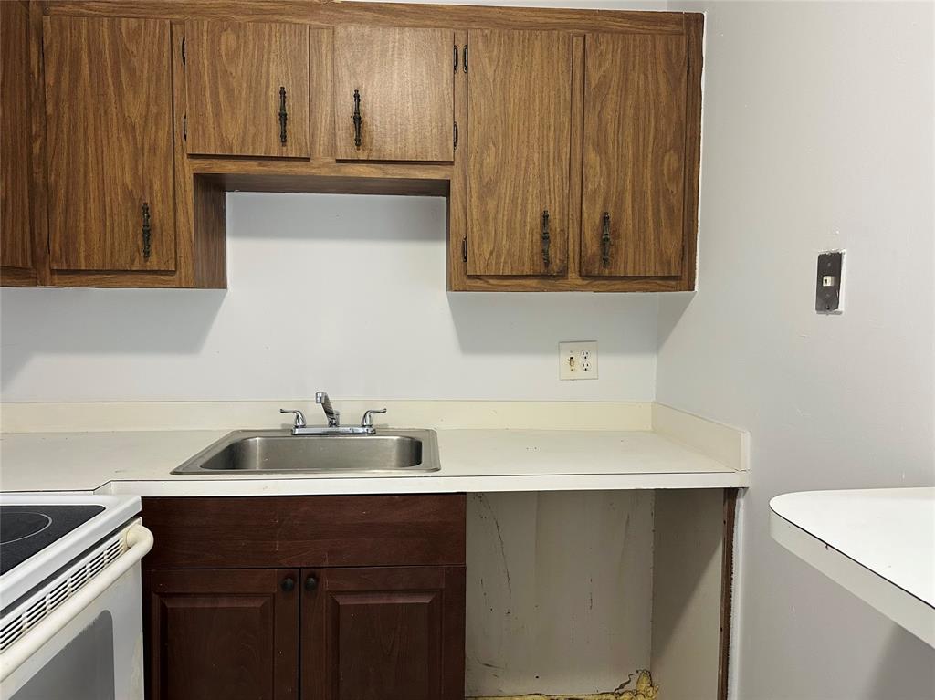 4174 Inverrary Drive, Unit 805 Lauderhill, FL 33319 - Photo 12 of 26 a sink with a cabinets