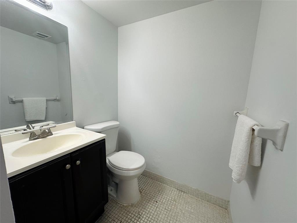 4174 Inverrary Drive, Unit 805 Lauderhill, FL 33319 - Photo 15 of 26 a bathroom with a sink toilet and vanity