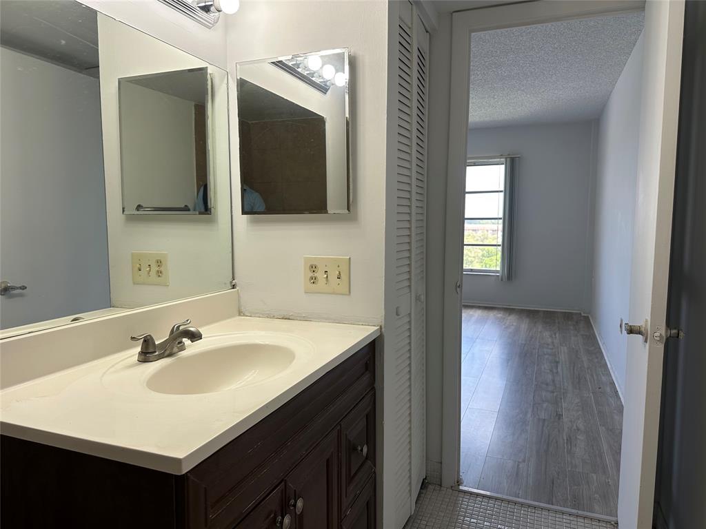 4174 Inverrary Drive, Unit 805 Lauderhill, FL 33319 - Photo 22 of 26 a bathroom with a sink and a mirror