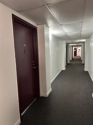 a kitchen with a sink cabinets and appliances