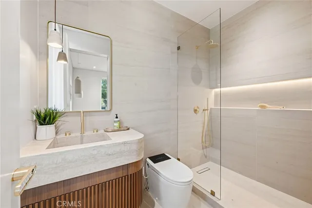 a bedroom with a white bed and a chair