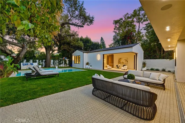 a view of outdoor sitting space and garden