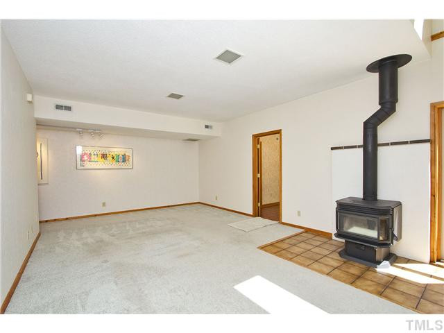 3729 Bosco Road New Hill, NC 27562 - Photo 17 of 25 Another view of den/family/great room to show gallery wall w/gallery lighting. Den/Family/Great Room