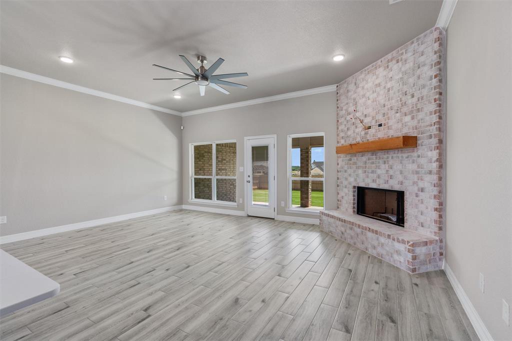 1341 Promised Land Road Hewitt, TX 76643 - Photo 8 of 29 Expansive living area with wood burning fireplace