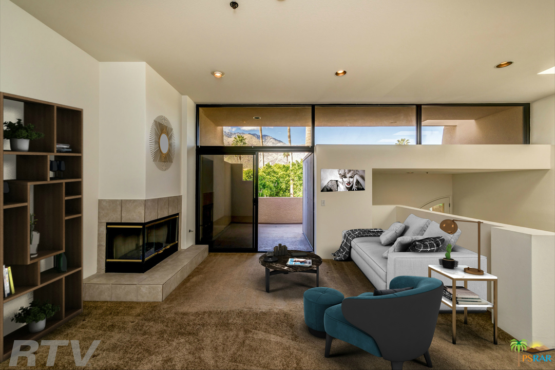 a living room with furniture window and a flat screen tv