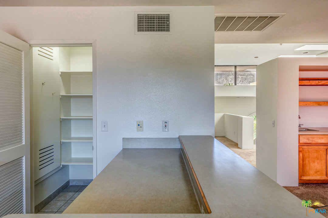 100 East Stevens Road, Unit 513 Palm Springs, CA 92262 - Photo 12 of 39 a view of kitchen and wooden floor
