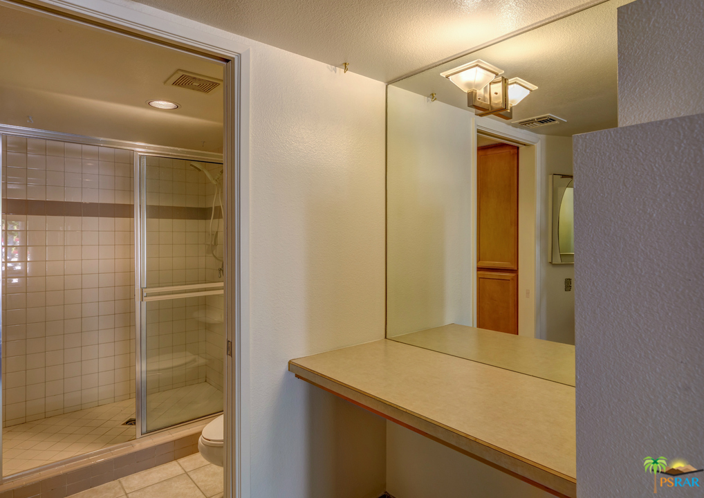 100 East Stevens Road, Unit 513 Palm Springs, CA 92262 - Photo 22 of 39 a bathroom with a shower and a sink