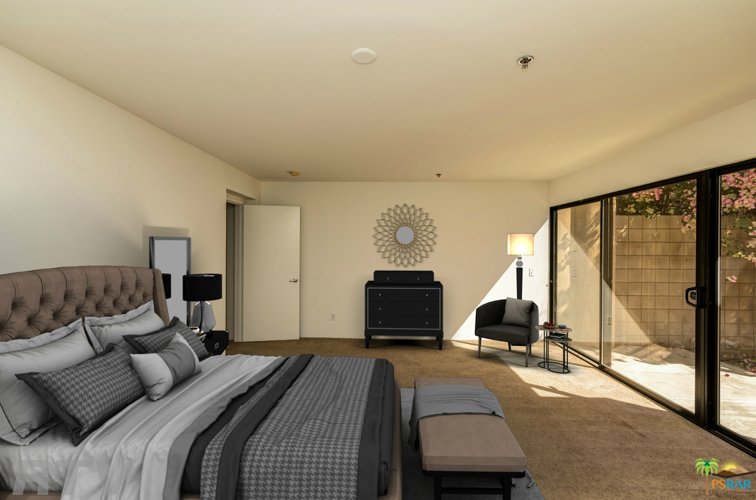 100 East Stevens Road, Unit 513 Palm Springs, CA 92262 - Photo 27 of 39 a bedroom with a bed and large windows