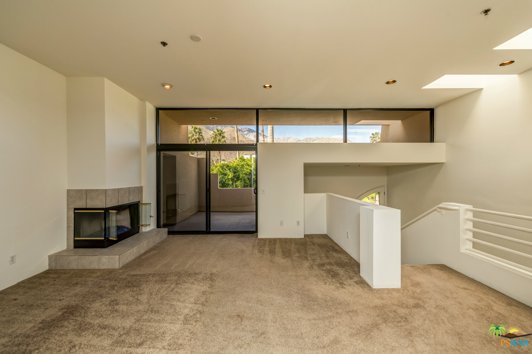 100 East Stevens Road, Unit 513 Palm Springs, CA 92262 - Photo 7 of 39 a view of a livingroom with an empty space and fireplace