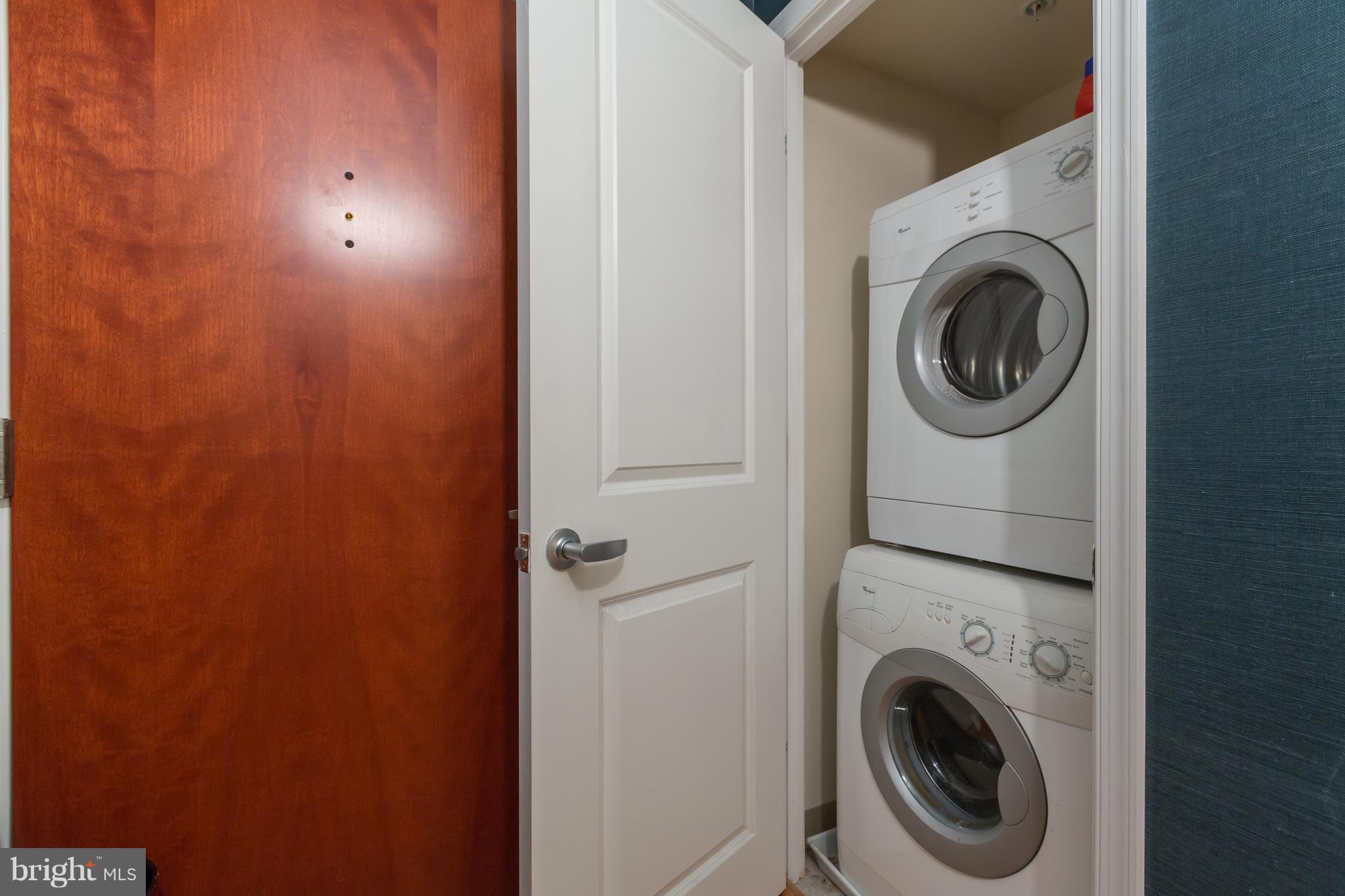 915 E Street Northwest, Unit 613 Washington, DC 20004 - Photo 22 of 30 a view of storage and utility room with washer and dryer
