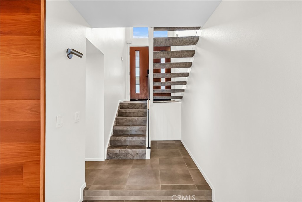 2247 El Capitan Drive Riverside, CA 92506 - Photo 20 of 61 a view of a hallway with wooden floor and staircase