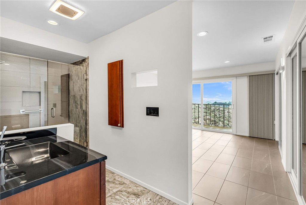 2247 El Capitan Drive Riverside, CA 92506 - Photo 24 of 61 a kitchen with a sink and a refrigerator