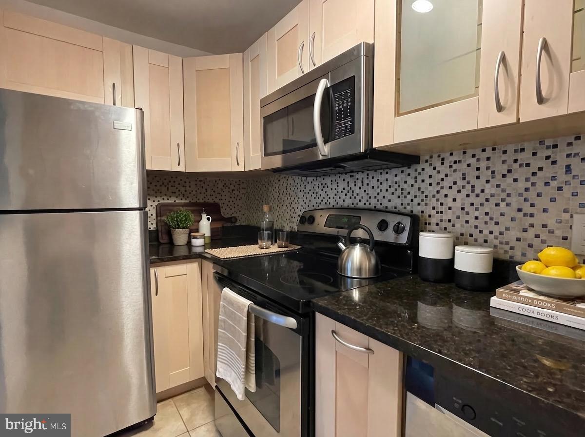 520 N Street Southwest, Unit S317 Washington, DC 20024 - Photo 12 of 64 a kitchen with a sink a stove and refrigerator