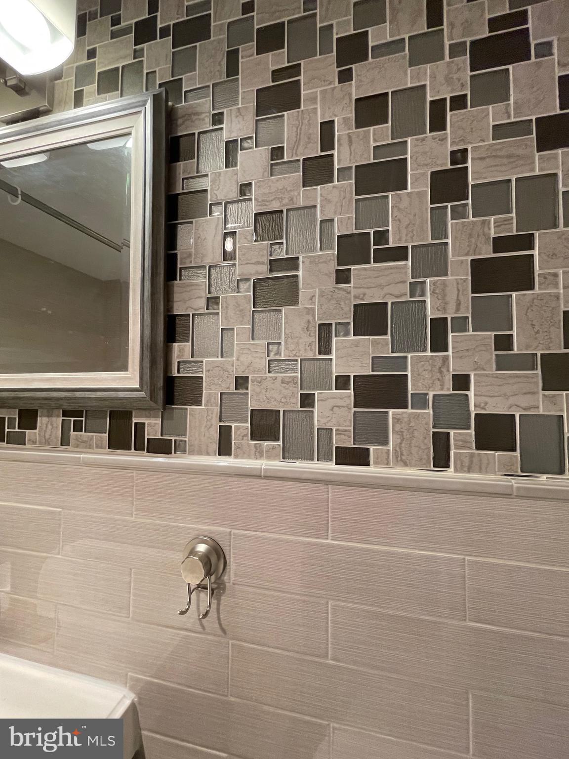520 N Street Southwest, Unit S317 Washington, DC 20024 - Photo 19 of 64 a bathroom with a sink and a mirror