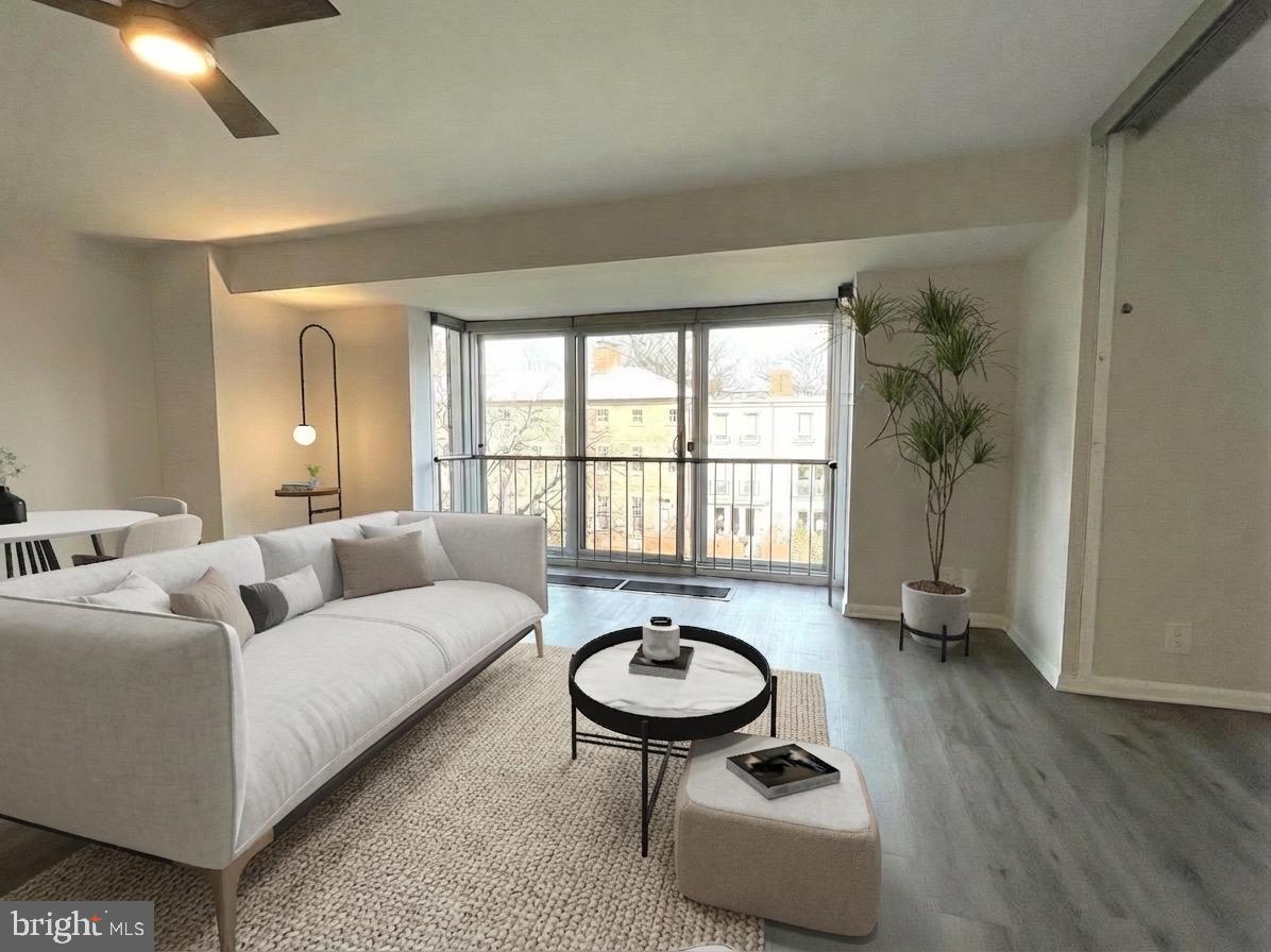 520 N Street Southwest, Unit S317 Washington, DC 20024 - Photo 2 of 64 a living room with furniture a window and a chandelier