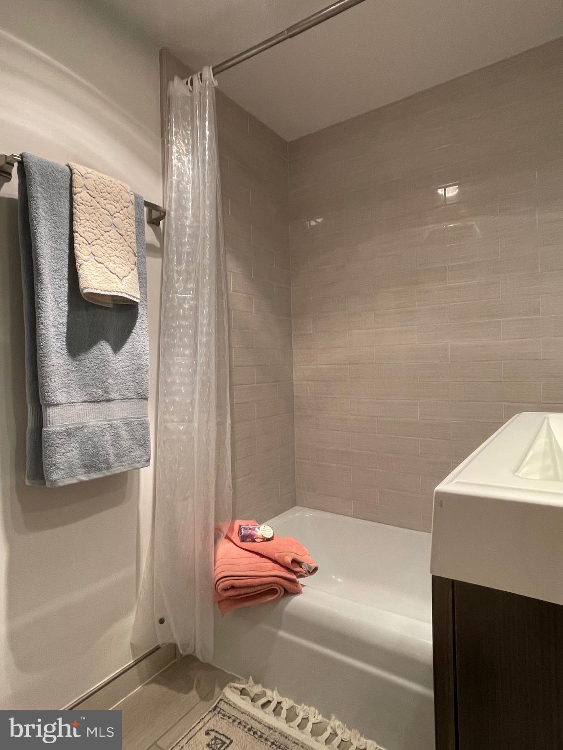 520 N Street Southwest, Unit S317 Washington, DC 20024 - Photo 21 of 64 a bathroom with a tub and shower