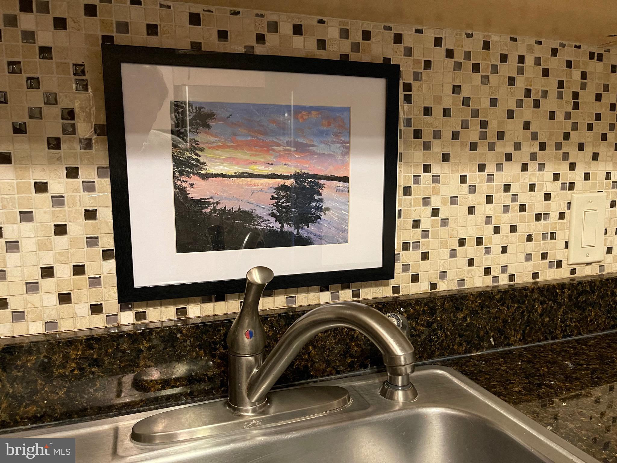520 N Street Southwest, Unit S317 Washington, DC 20024 - Photo 33 of 64 a bathroom with a granite countertop sink a vanity and a window