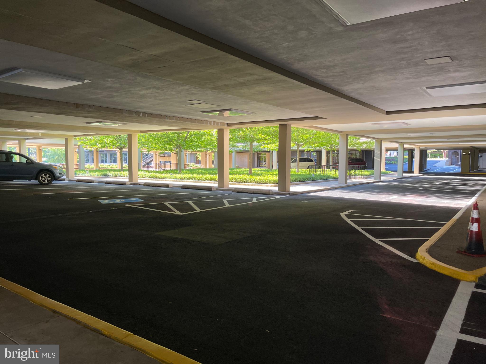 520 N Street Southwest, Unit S317 Washington, DC 20024 - Photo 73 of 74 Spacious parking with lush greenery.