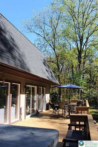 front view of a building with a garden