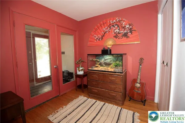 a room with furniture and wooden floor