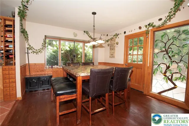 a view of a dining room with furniture window and wooden floor