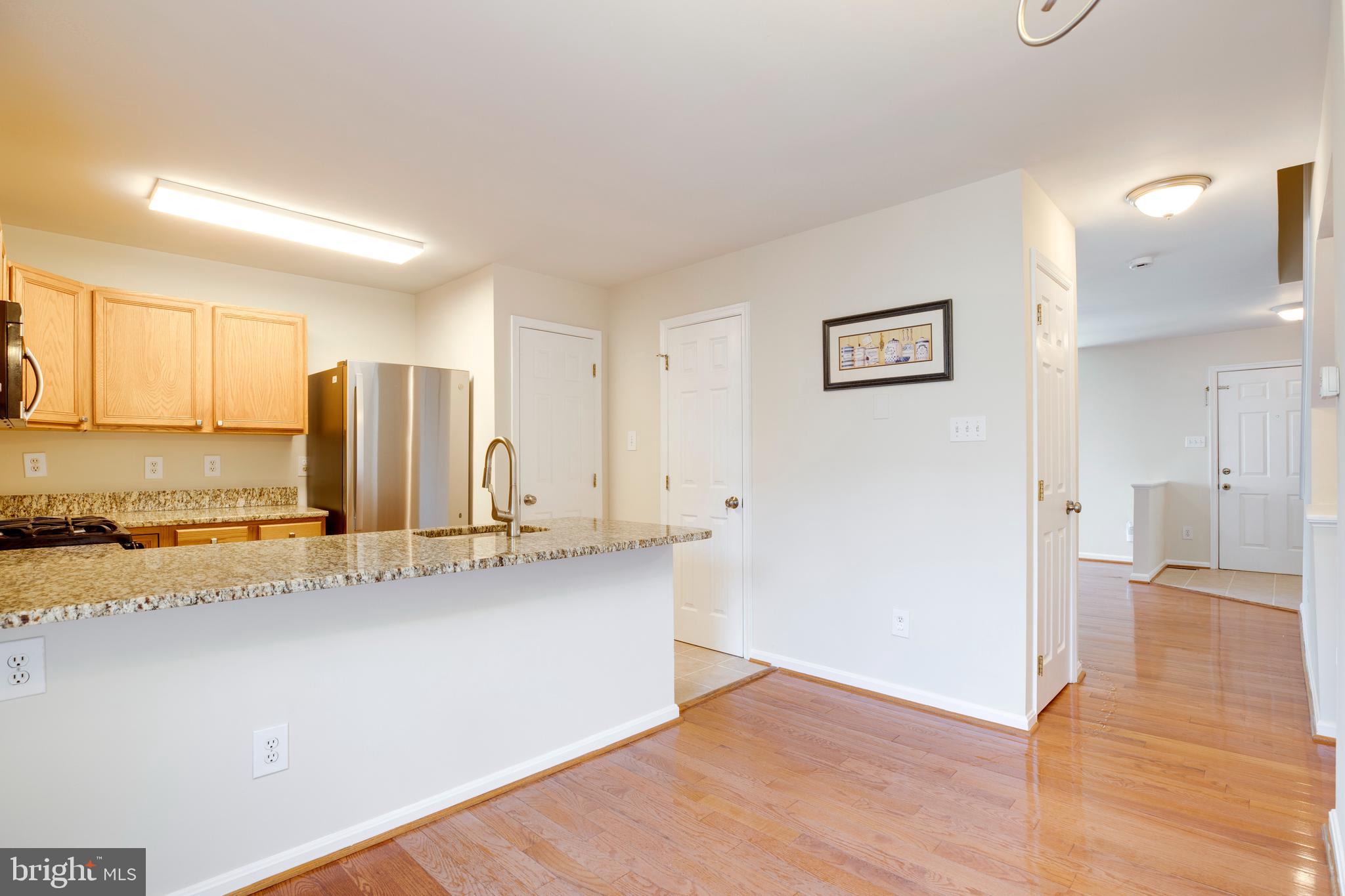 14113 Asher View Centreville, VA 20121 - Photo 12 of 47 a view of a kitchen with a sink and cabinets