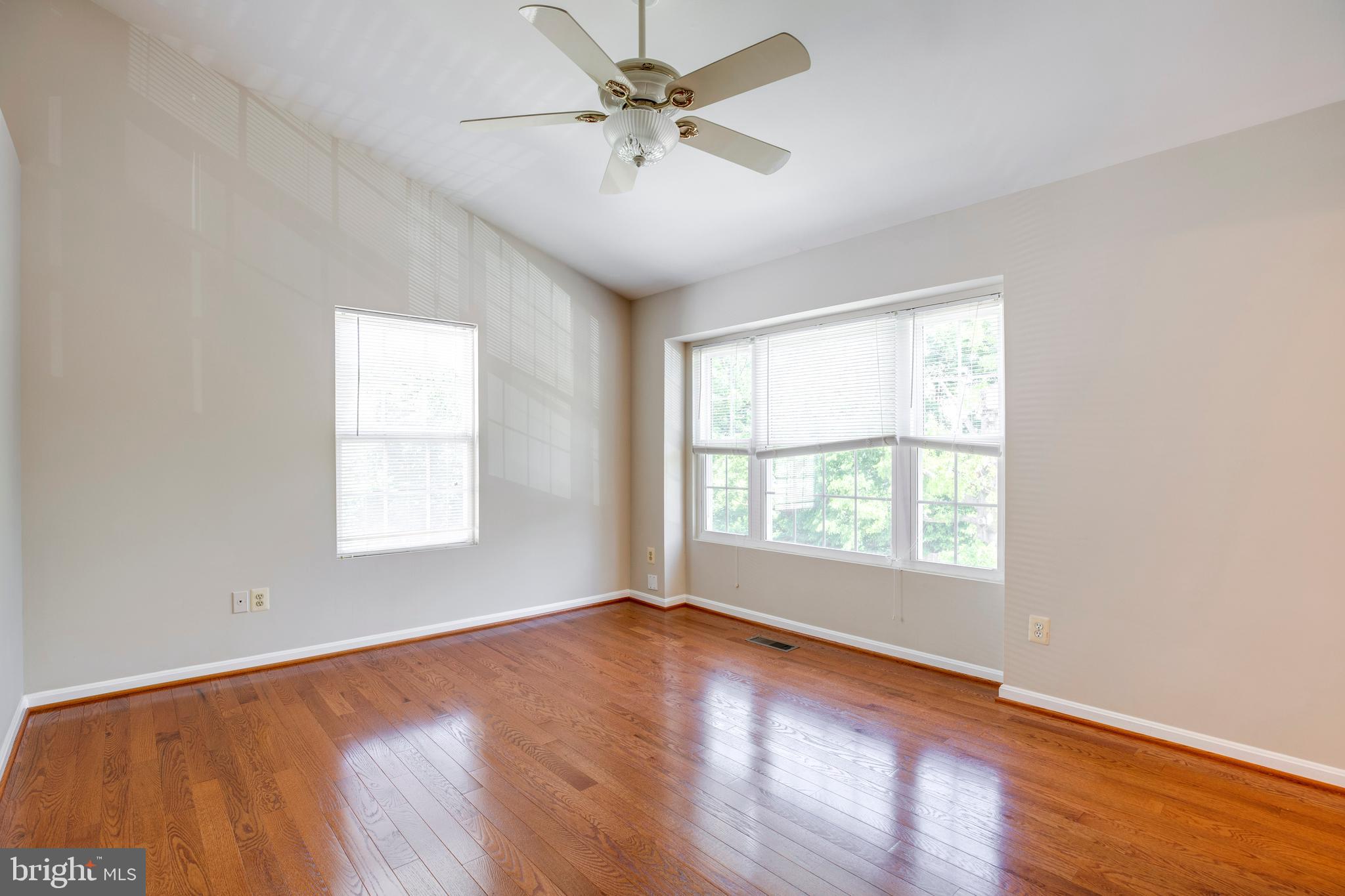 14113 Asher View Centreville, VA 20121 - Photo 19 of 47 an empty room with wooden floor and windows