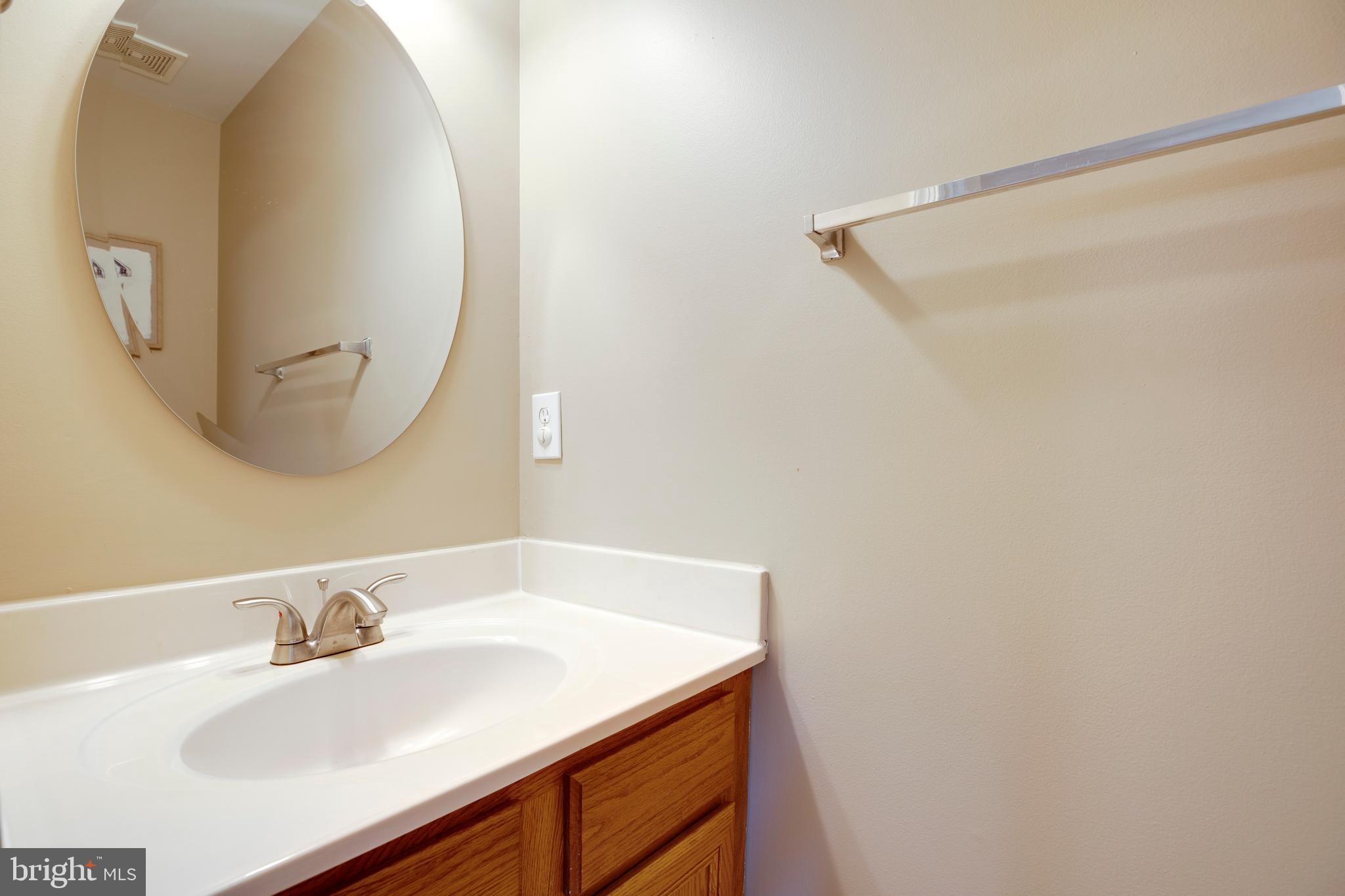 14113 Asher View Centreville, VA 20121 - Photo 21 of 47 a bathroom with a sink and a mirror