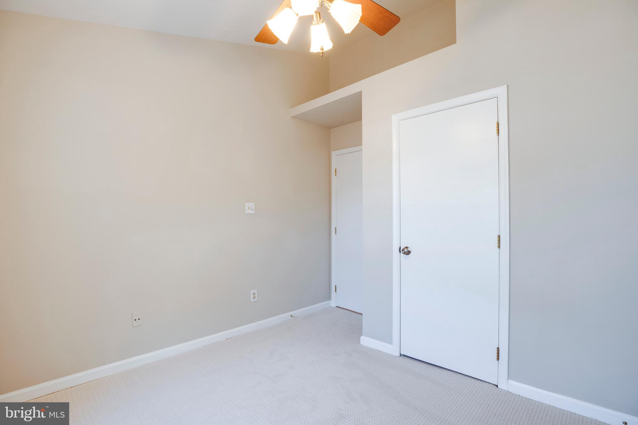 14113 Asher View Centreville, VA 20121 - Photo 24 of 47 an empty room with a chandelier fan