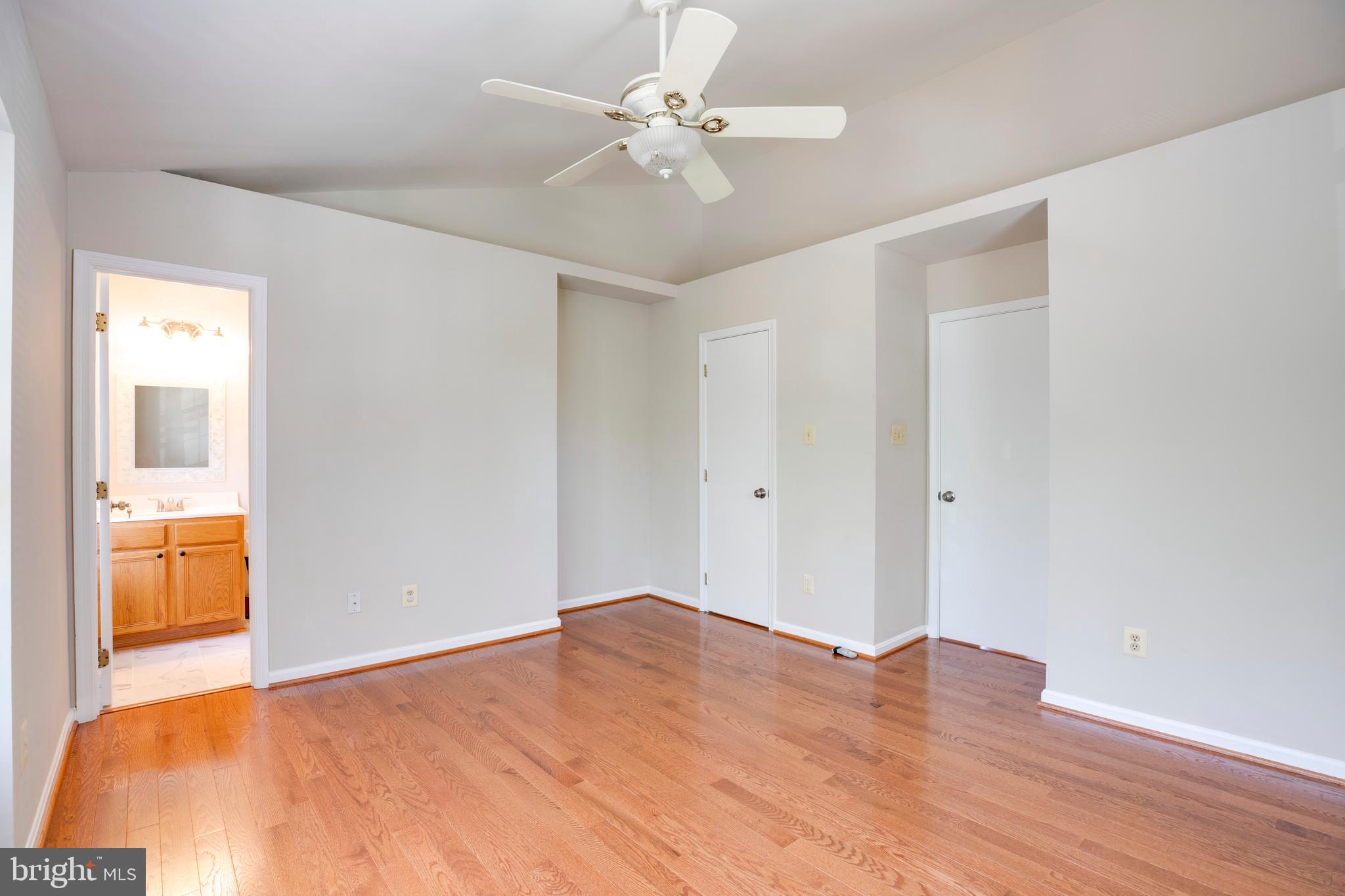 14113 Asher View Centreville, VA 20121 - Photo 29 of 47 a bedroom with a bed and a chandelier fan