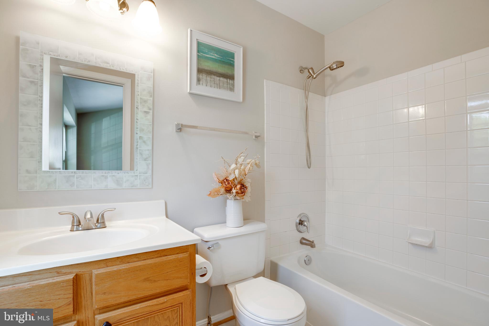 14113 Asher View Centreville, VA 20121 - Photo 30 of 47 a bathroom with a sink toilet vanity and shower