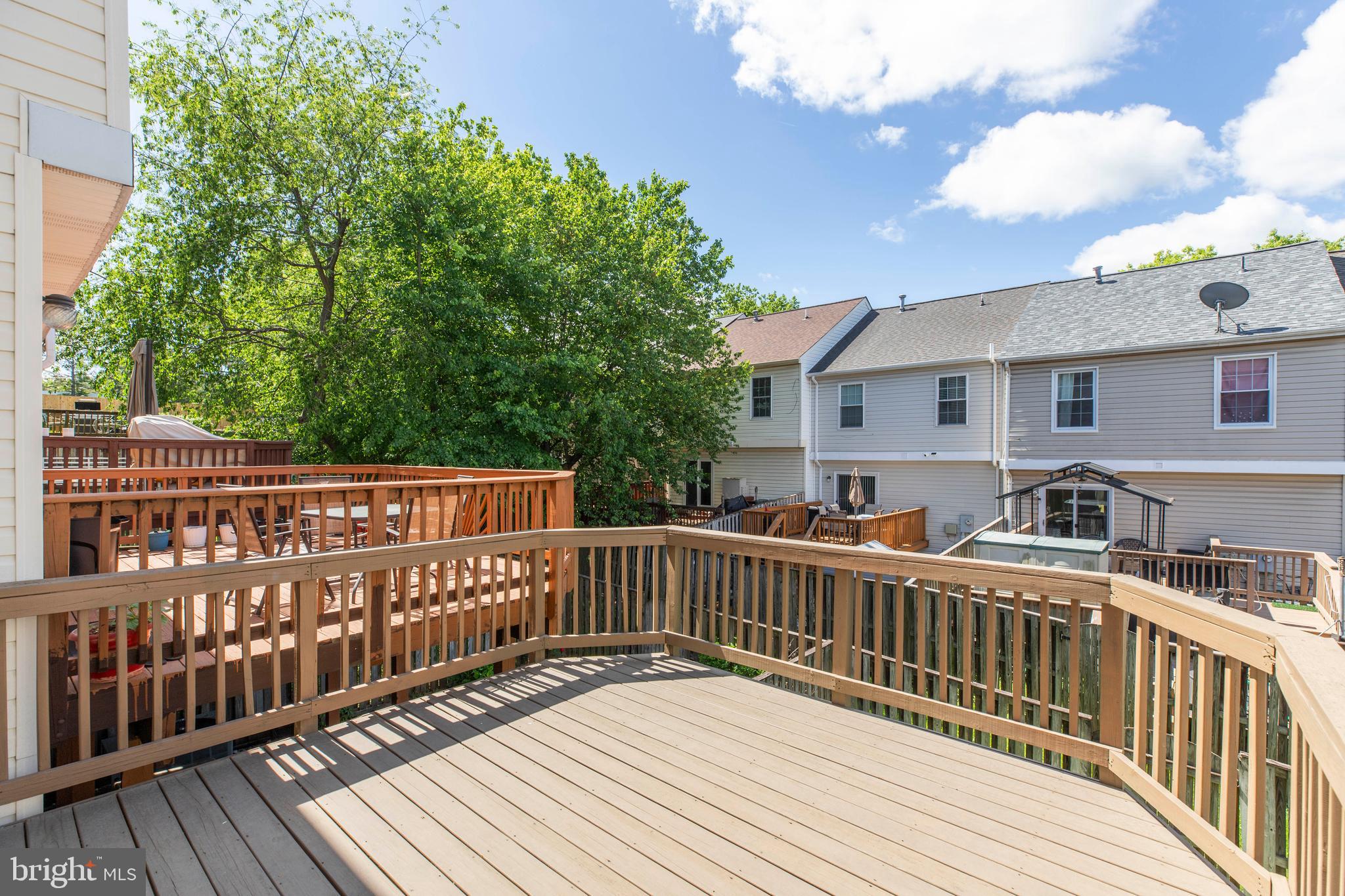 14113 Asher View Centreville, VA 20121 - Photo 46 of 47 a view of a wooden deck and a yard