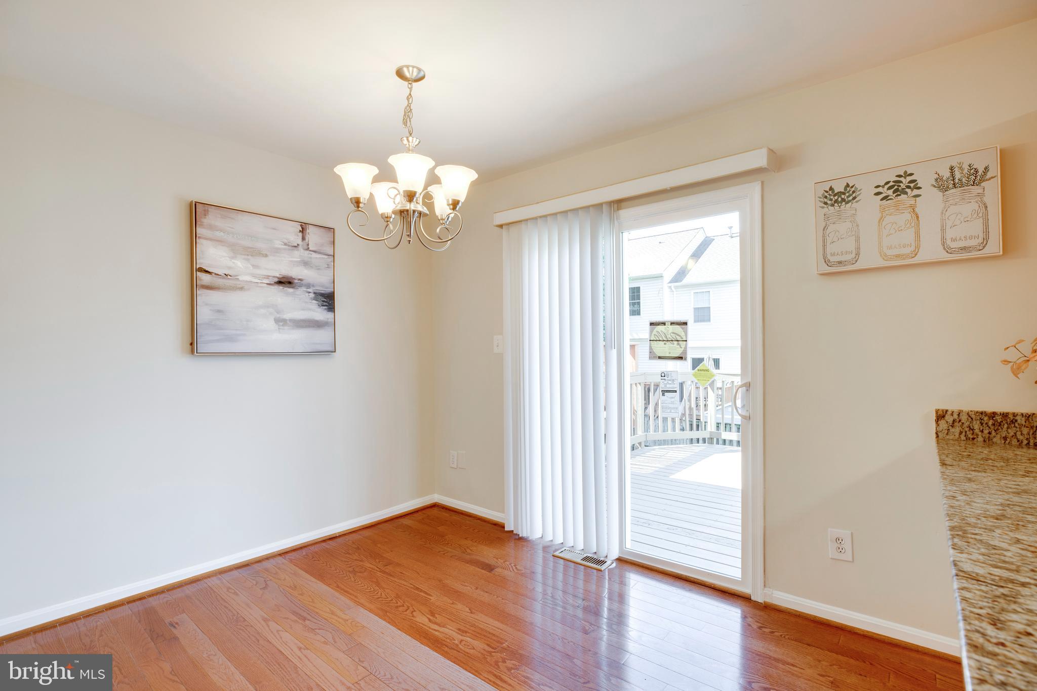 14113 Asher View Centreville, VA 20121 - Photo 10 of 47 a view of a bedroom with wooden floor