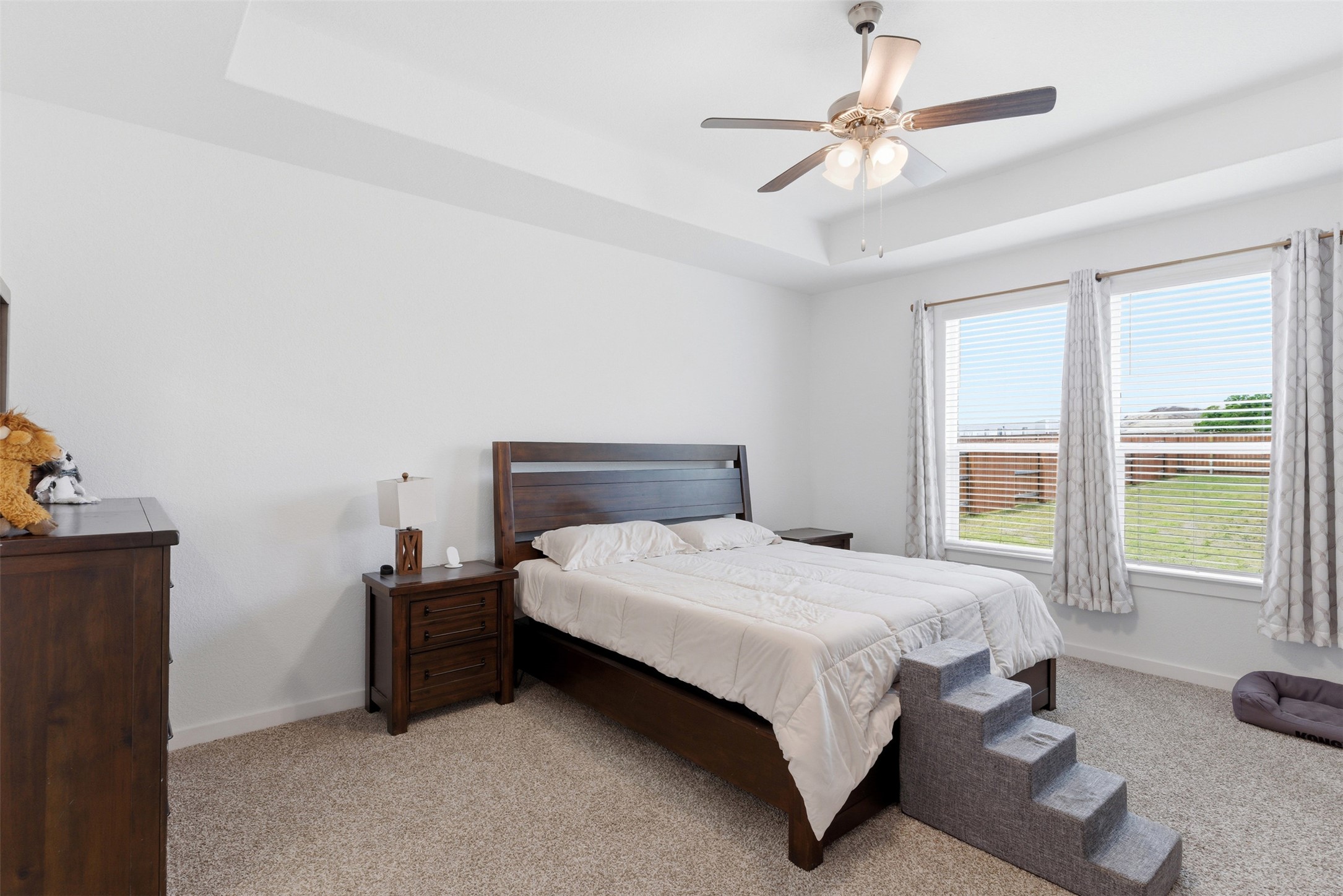 105 Nuntree Cove Georgetown, TX 78628 - Photo 11 of 31 a bed sitting in a bedroom next to a window