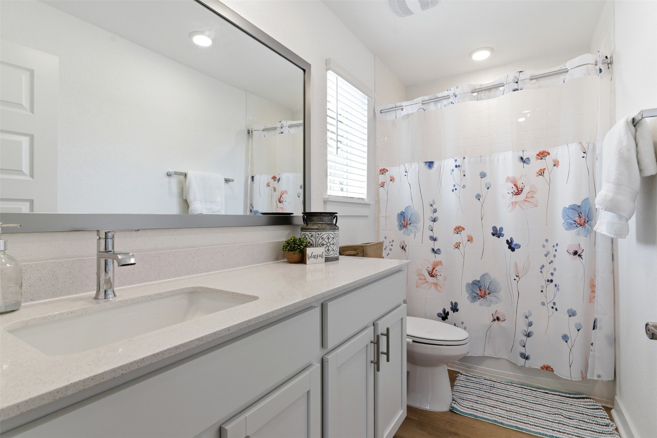 105 Nuntree Cove Georgetown, TX 78628 - Photo 24 of 31 a bathroom with a sink a toilet a shower and a mirror