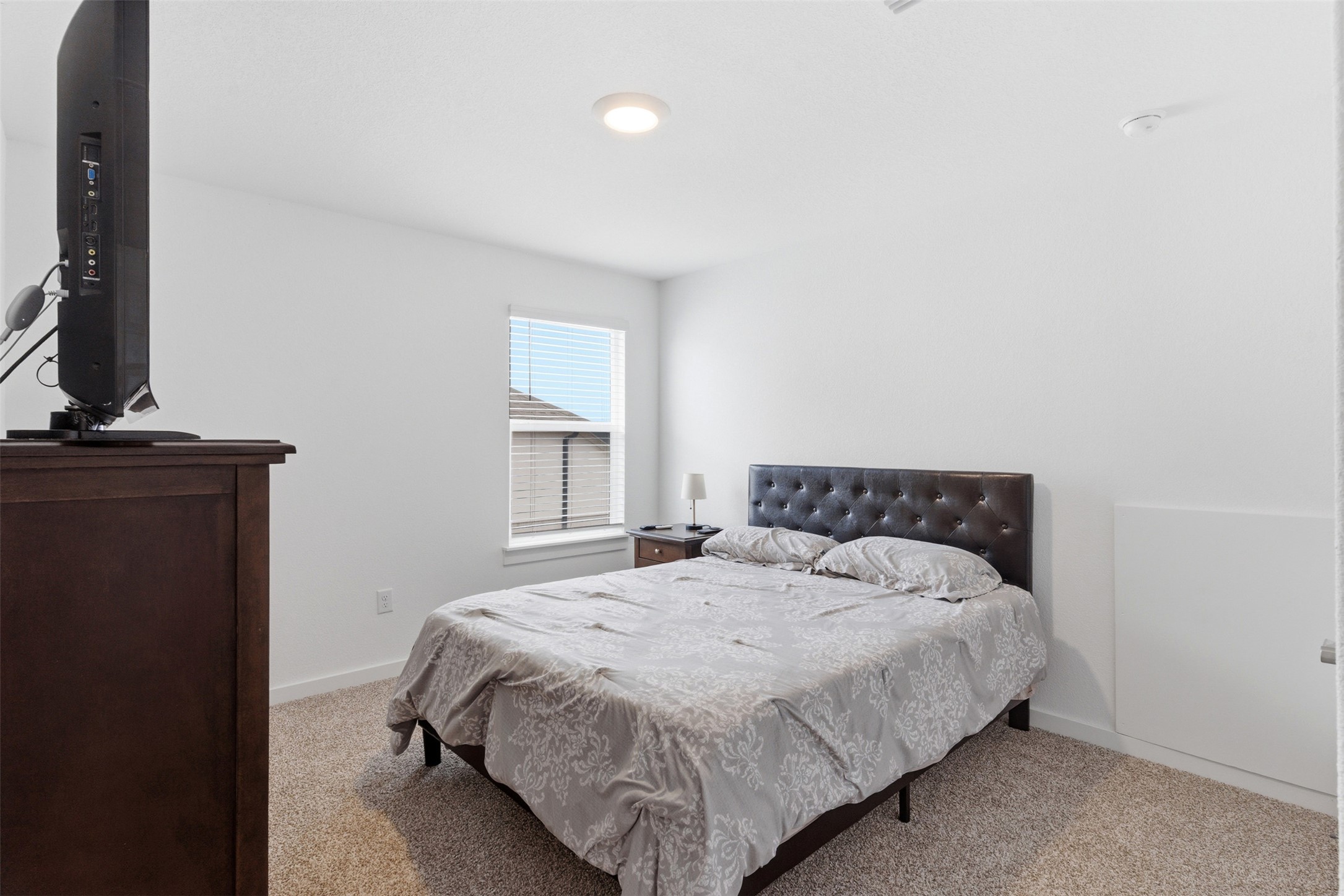 105 Nuntree Cove Georgetown, TX 78628 - Photo 25 of 31 a bedroom with a bed and window
