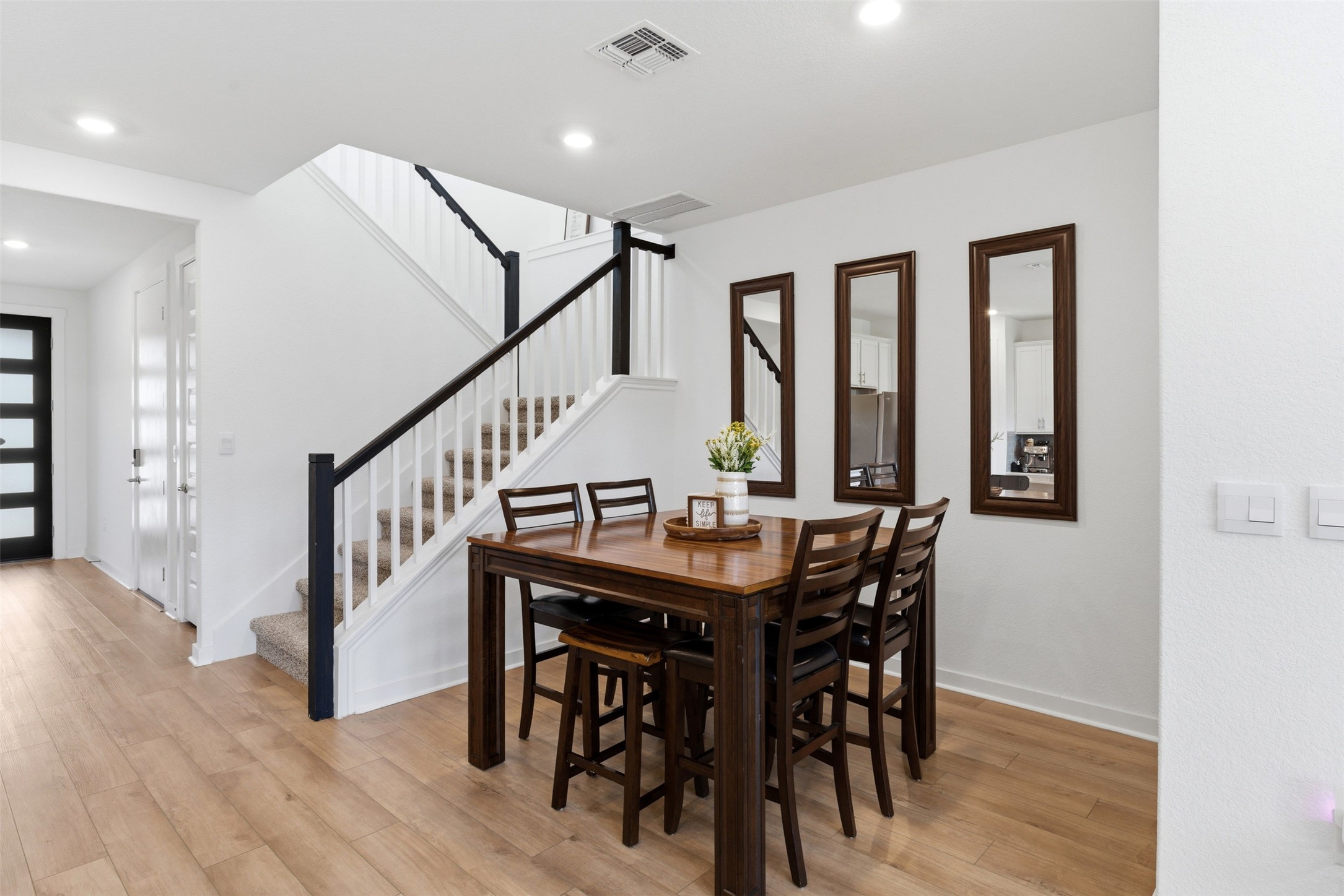 105 Nuntree Cove Georgetown, TX 78628 - Photo 7 of 31 a view of a dining room with furniture and wooden floor